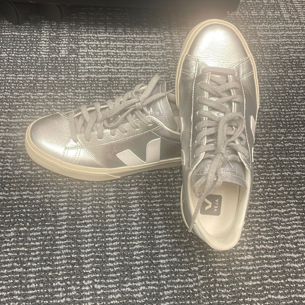 Gently worn leather sneakers.